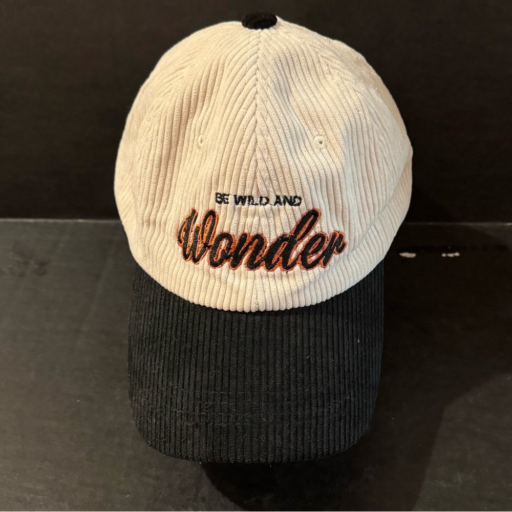 Black and white cap
“Be wild and wonder” 
Adjustable strap